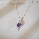 Witchlight amethyst crystal pendant wrapped in silver wire